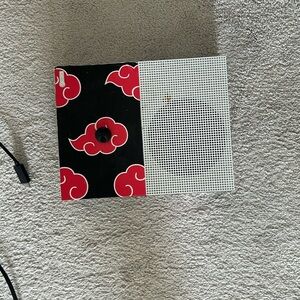 Xbox one with (non permanent) red and black skin on it